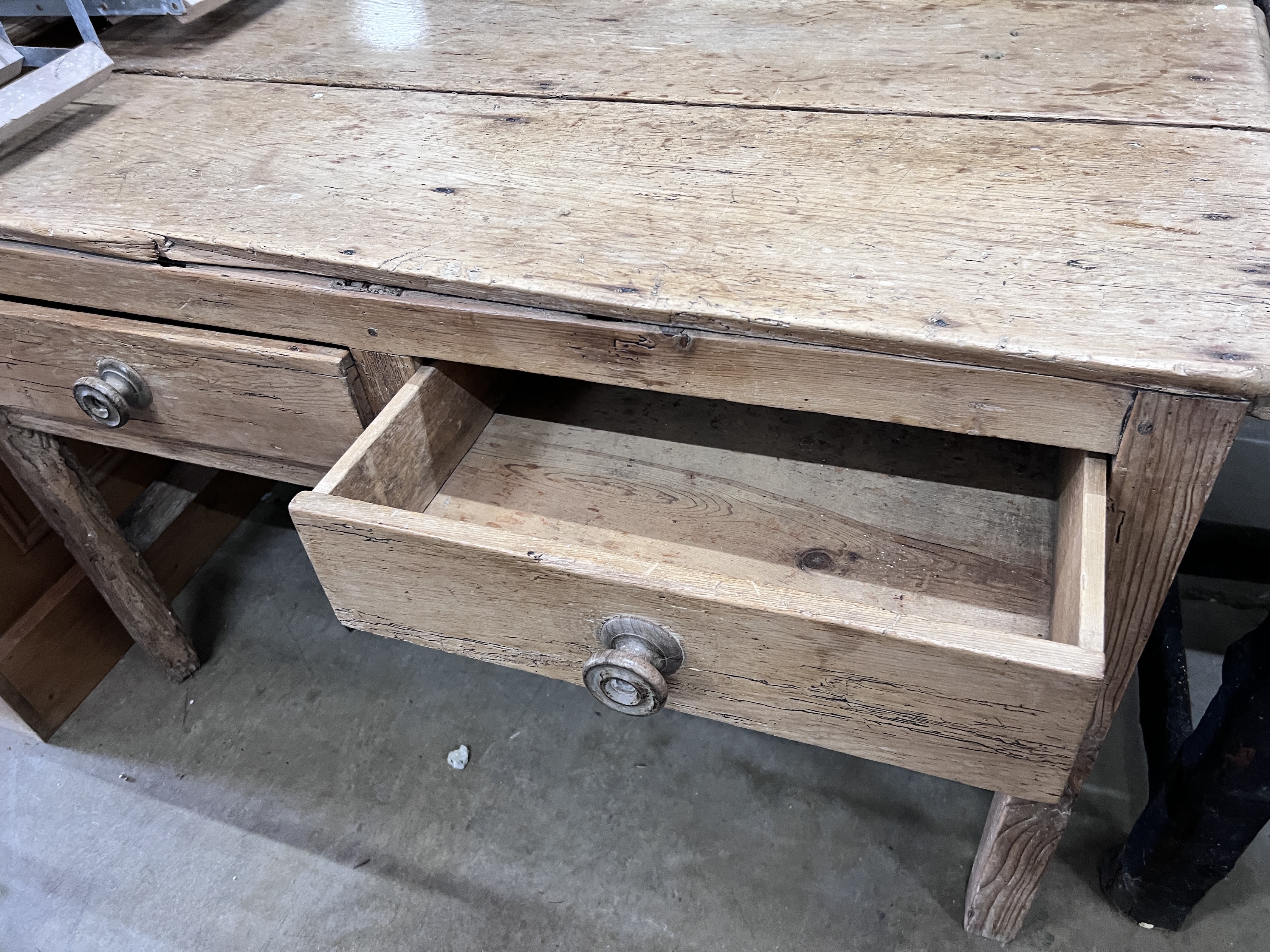 A 19th century pine two drawer table, width 118cm, depth 59cm, height 73cm